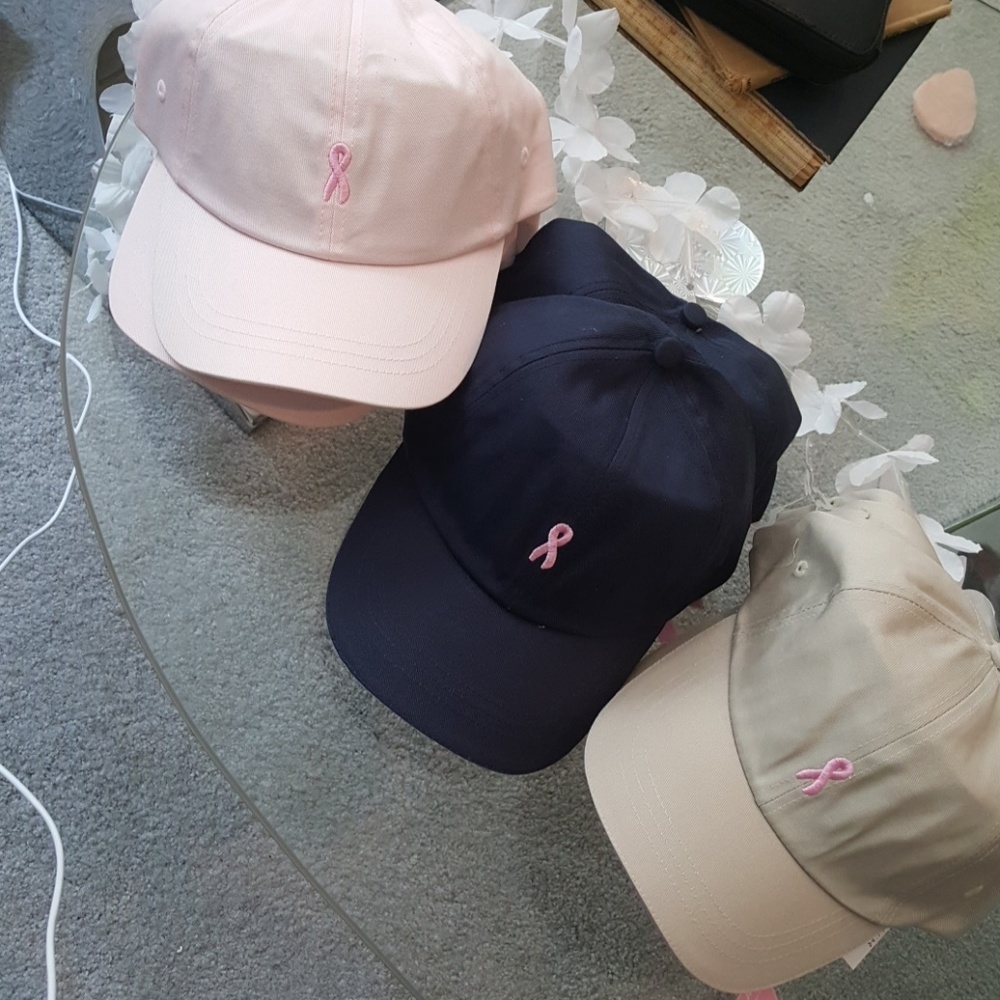Ball cap.  Pink breast cancer ribbon on front.